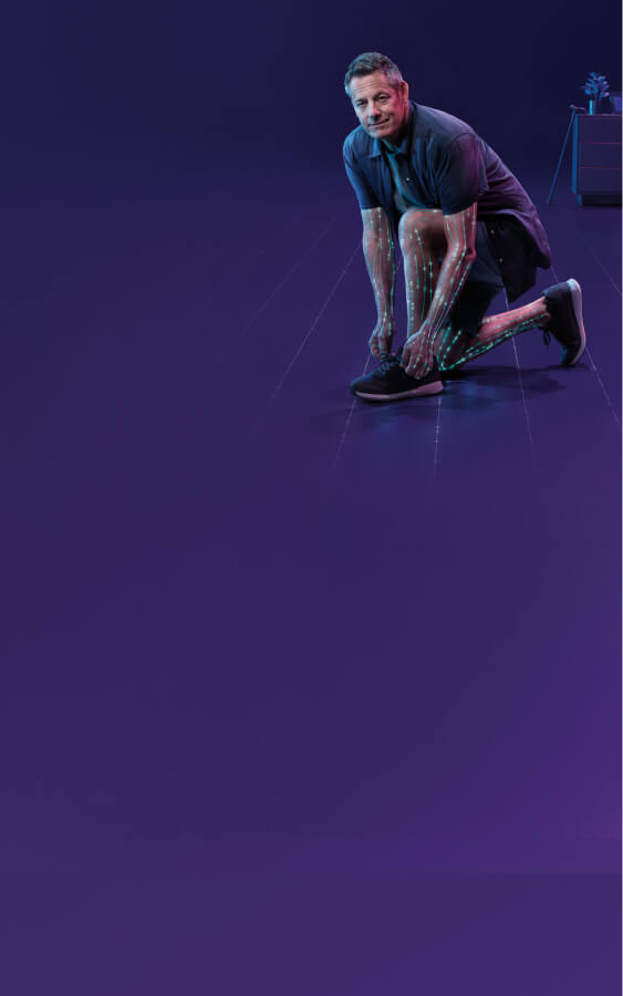 Man with CIDP kneeling and tying his shoe on a purple background with nerve activations on arms and legs.